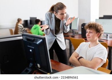 Female teacher shouting at young boy student because of discipline problems. - Shutterstock ID 2154896561