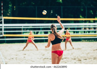 Female team playing beach volleyball