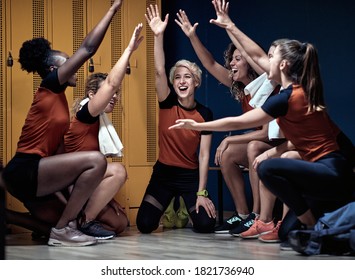 Female team ready for the match in a locker room - Powered by Shutterstock