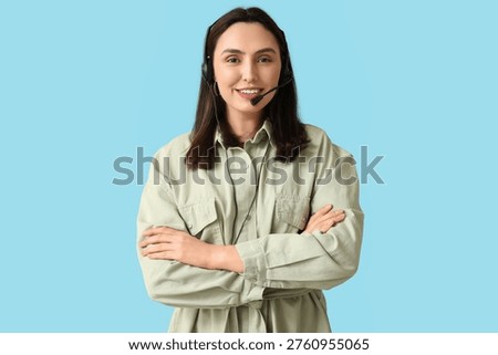 Female technical support agent in headset on blue background