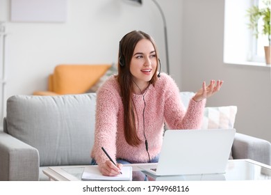 Female technical support agent working at home - Shutterstock ID 1794968116