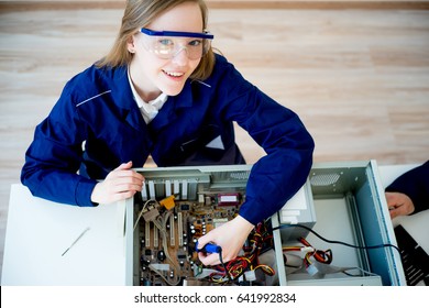 Female Technician Repairing A Computer