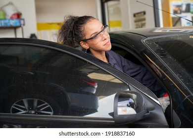 Female Technician Try To Repair Car In Car Service Garage With Start The Car And Check Engine Sound