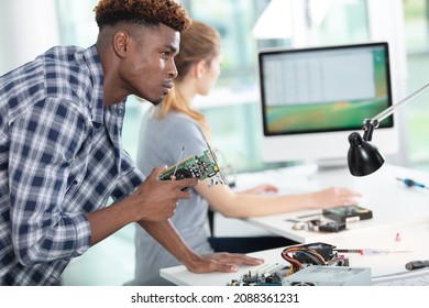 Female Technician Working With Transistor