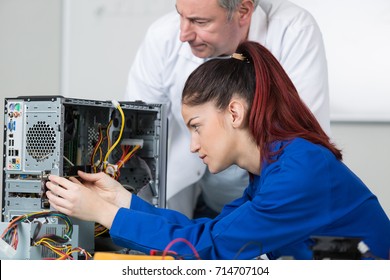 Female Technician Working With Transistor