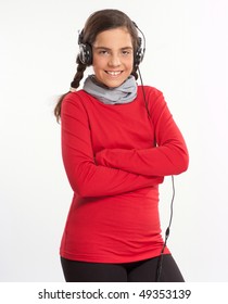 Female teenager listening music with big headphones - Shutterstock ID 49353139
