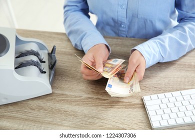 Female Teller Counting Money At Cash Department, Closeup