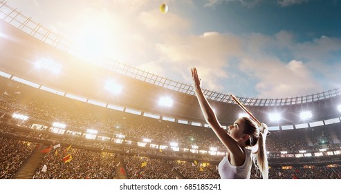 Female tennis player in action during game on the professional stadium full of people. She is wearing unbranded sport clothes. The stadium is made in 3D.