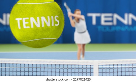 Female Tennis Player Hitting Ball With A Racquet, 3D Special Effect Ball Flying Towards The Screen With Tennis Written On It. Sports TV Woman Athlete Competing On A World Cup. VFX Photo Edit.