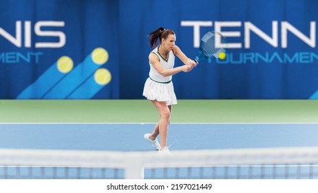 Female Tennis Player Hitting Ball With A Racquet During Championship Match. Technical Woman Athlete Receives And Lands Perfect Backhand Shot. Live World Sports Tournament Concept.