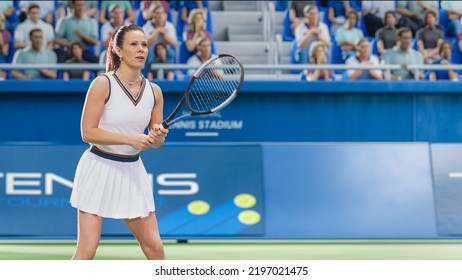 Female Tennis Player Hitting Ball With A Racquet During Championship Match. Professional Woman Athlete Striking Ball. World Sports Tournament. Excited Crowd Cheering On Background.