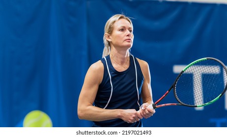 Female Tennis Player Hitting Ball With A Racquet During Championship Match. Professional Woman Athlete Successfully Striking Ball. World Sports Tournament. TV Channel Live Broadcast Concept.