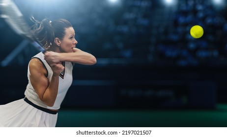 Female Tennis Player Hitting Ball With A Racquet During Championship Match. Professional Woman Athlete Striking Ball. World Sports Tournament. Sportswoman Winning Final Set Of The Game.