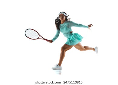 Female tennis player in mint-green outfit prepares to return shot, her expression focused against white studio background. Concept of professional sport, championship, active lifestyle, tournament. Ad - Powered by Shutterstock