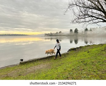 Female And Their Dog Walking In Seward Park