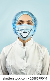 Female Therapist With Funny Smiling Medical Mask. Dentist In Funny Mask