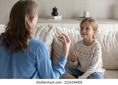 Female Therapist Teaching Pretty Kid Girl To Speak Gestures Language. Teacher And Child Practicing Speaking, Sign Communication, Vocal Exercises, Correct Pronouncing, Foreign Language Skills