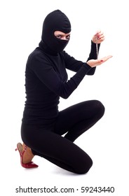 Female Thief In Black Clothes And Balaclava Keeping Bracelet