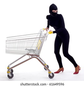 Female Thief In Black Clothes And Balaclava With Shopping Cart