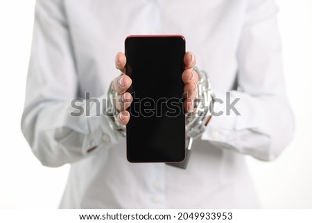 Female tied hands with chain hold mobile phone