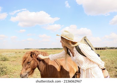 Female Tourist With Cute Pony Horse In Wildlife Sanctuary