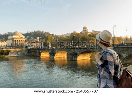 Similar – Image, Stock Photo A woman iis looking at her smartphone outdoors.