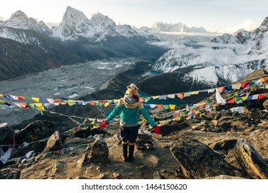 Female Tourist Hikking At Gokyo Ri Mountain Peak Near Gokyo Lake During Everest Base Camp Trekking