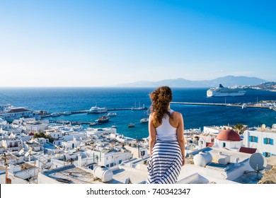 Female Tourist Looking At Mykonos Town, Greece