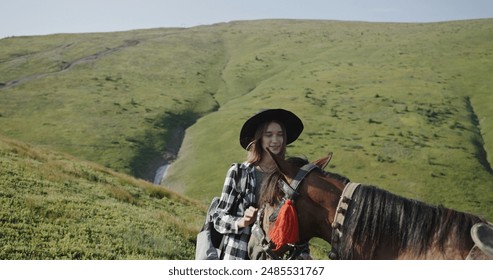 Female Tourist Preparing Horse for Journey in Carpathian Mountains - Powered by Shutterstock