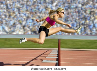 Female track and field athlete hurdling. - Powered by Shutterstock