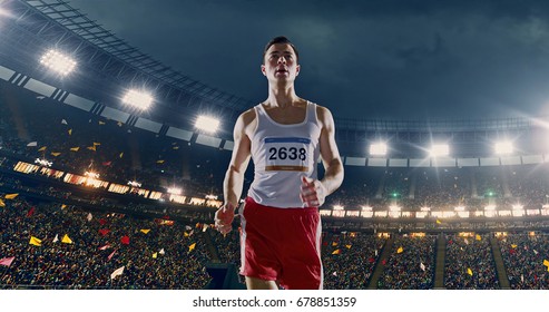 Female Track And Field Runner On The Professional Sports Arena With Bleaches Full Of People. Athlete Wears Unbranded Clothes. Arena And People On It Are Made In 3D And Animated.