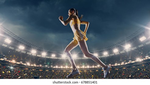 Female Track And Field Runner On The Professional Sports Arena With Bleaches Full Of People. Athlete Wears Unbranded Clothes. Arena And People On It Are Made In 3D And Animated.