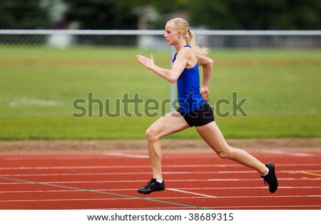 A female track star racing down the track