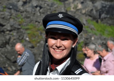 Female Train Conductor On The Famous Flam Railway Station. June 17,2018. Flam, Norway, Scandinavia.