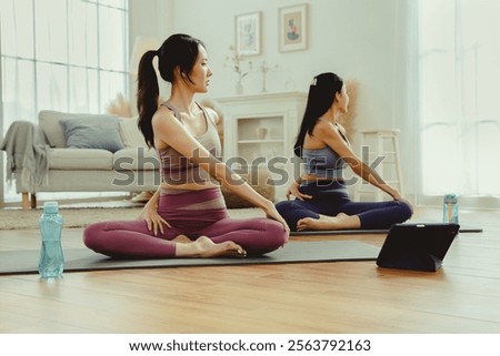 Similar – Image, Stock Photo A female trainer teaching a student how to do push-ups correctly.Outdoor sports in urban environment