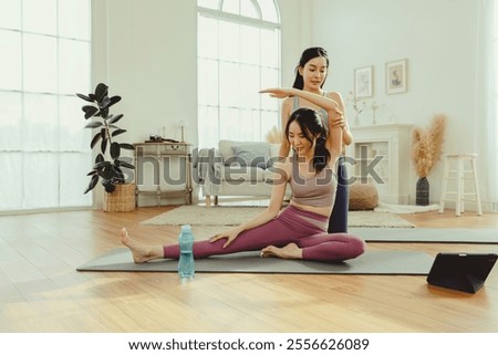 Similar – Image, Stock Photo A female trainer teaching a student how to do push-ups correctly.Outdoor sports in urban environment