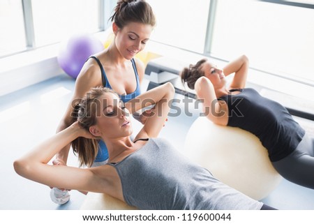 Image, Stock Photo A female trainer teaching a student how to do push-ups correctly.Outdoor sports in urban environment