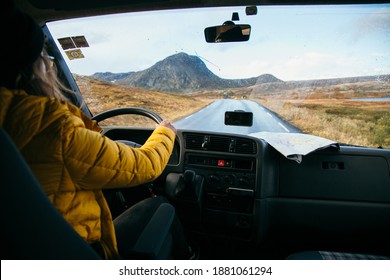 Female Traveller Drive Old Vintage Camper Van On Empty Winter Road. Scandinavian Road Trip Adventure In Converted Stealth Wild Camping RV Van. 