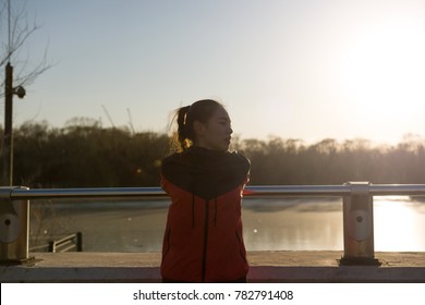 Female Triathlete Preparing For Run