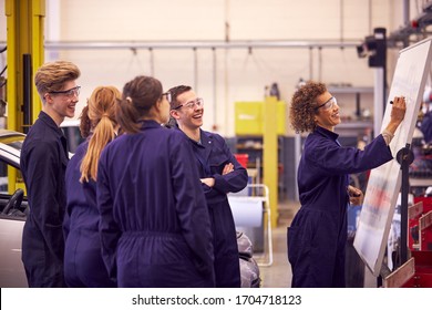 Female Tutor By Whiteboard With Students Teaching Auto Mechanic Apprenticeship At College - Shutterstock ID 1704718123