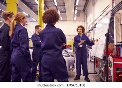 Female Tutor By Whiteboard With Students Teaching Auto Mechanic Apprenticeship At College - Shutterstock ID 1704718138
