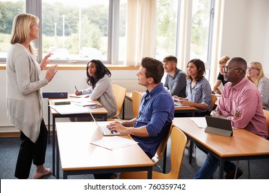 Female Tutor Teaching Class Of Mature Students