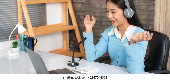 Female tutor wearing headset, using laptop and though camera to teaching new lesson by video conference on webcam while explaining math equations and physic formula on e-learning course for student