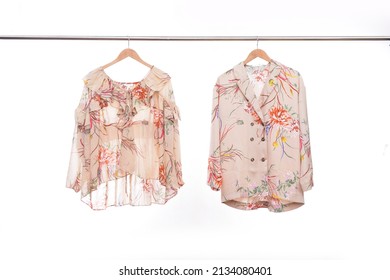 Female Two Floral Pattern , Shirt ,blouse On Hanging On White Background