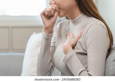 Female unhealthy Sickness, asian young woman, girl unwell and coughing, have cold, sore throat isolated white background suffering with symptom cough feeling bad. Healthcare of Coronavirus, covid-19. - Powered by Shutterstock