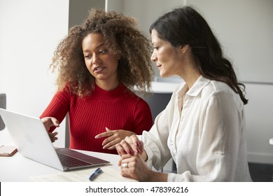 Female University Student Working One To One With Tutor