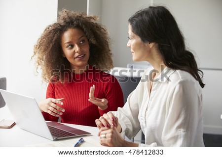 Female University Student Working One To One With Tutor