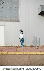 Female Urban Athlete On Hiit Training Doing Running In Place Exercise. Cardio Workout Outside During Coronavirus Pandemic. Sporty Woman Exercising With Face Mask.