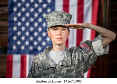 Female US Army Soldier In Front Of Usa Flag