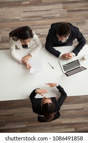 Female Vacancy Candidate Answering Questions At Job Interview Talking To Hr Managers Holding Resume At Office Table, Making Good First Impression, Recruiting And Hiring Concept, Top Vertical View